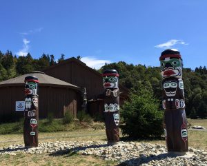 Three totem poles greet visitors to the Nuyambalees Cultural Center in Cape Mudge on Quadra Island.