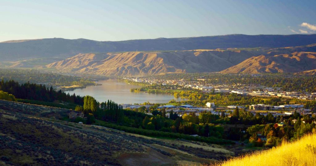 A view of my home town, Wenatchee, in Eastern Washington. The river seen here is Mighty Mother Columbia. The Wenatchee River, where my family lived, enters her at bottom right.