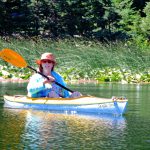 Sandy Brown Jensen doing nothing in a kayak on Hosmer Lake