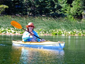 Sandy Brown Jensen doing nothing in a kayak on Hosmer Lake