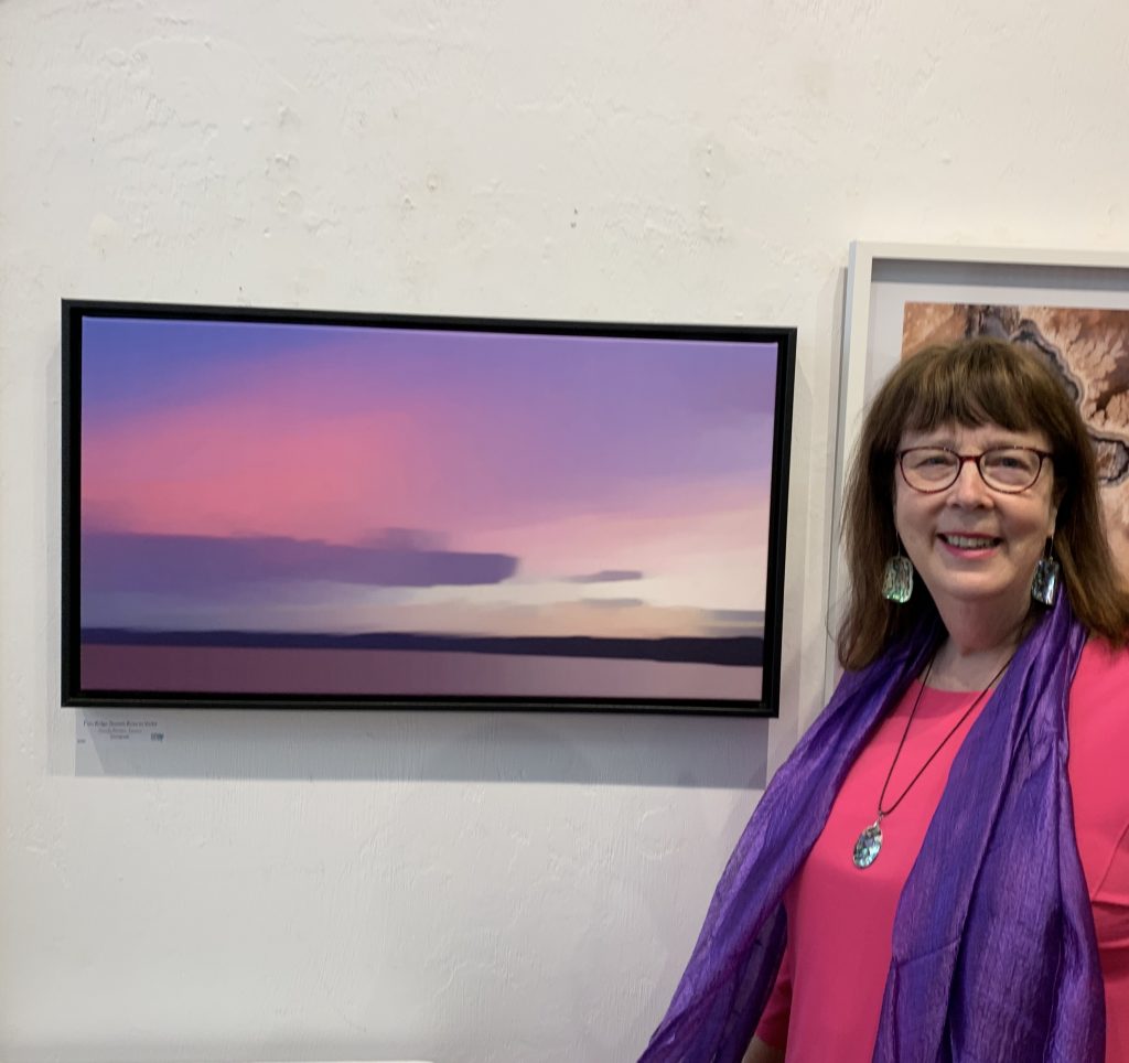 Sandy Brown Jensen showing her submission at the Photography at the Emerald national Juried Show 2019